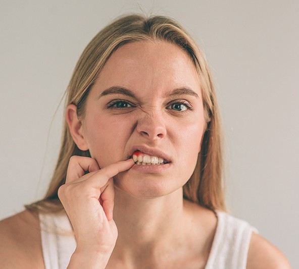 Woman with red and inflamed gums