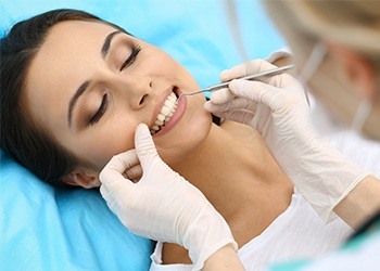 Woman receiving gum disease treatment