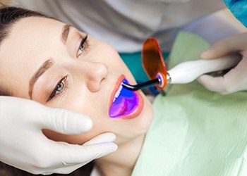 Patient receiving dental sealants