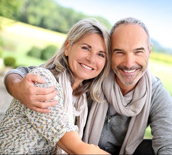 Smiling older man and woman