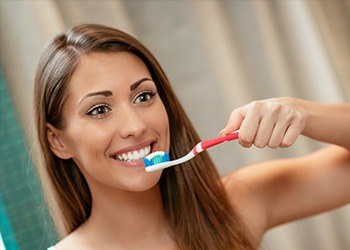 Woman brushing teeth