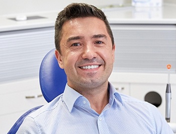 Smiling man in dental chair